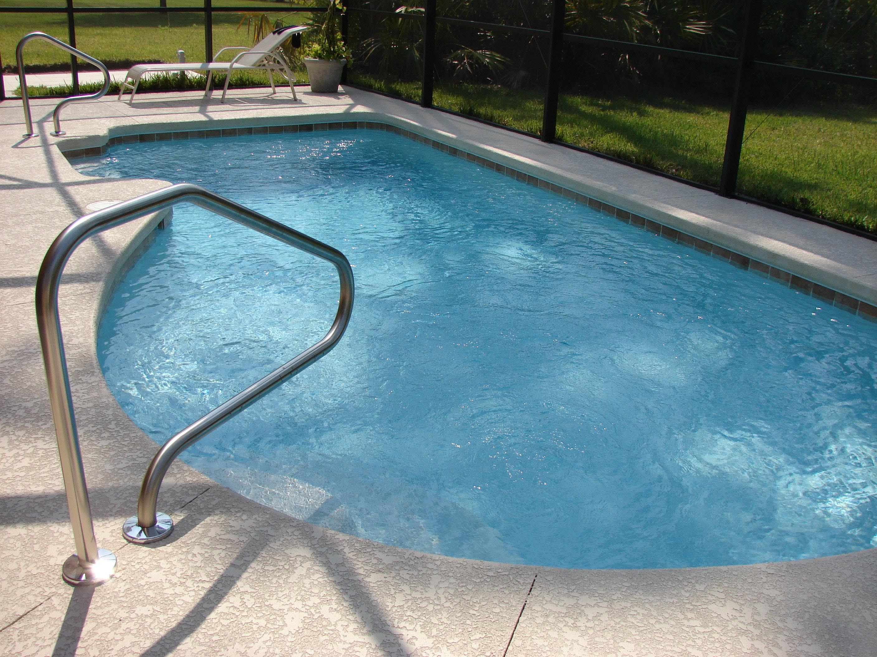 a pool next to a fence